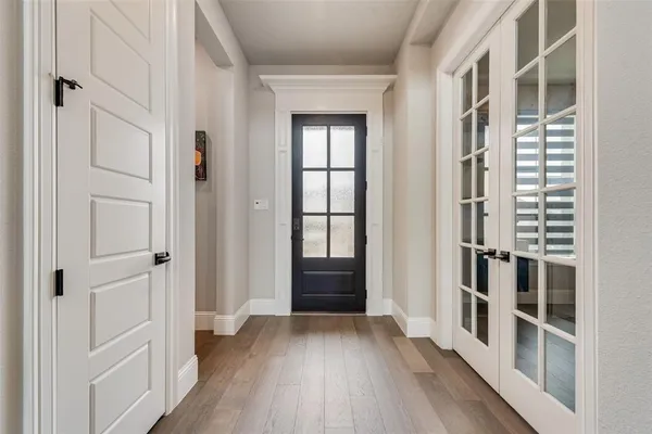 wooden floor in a white room