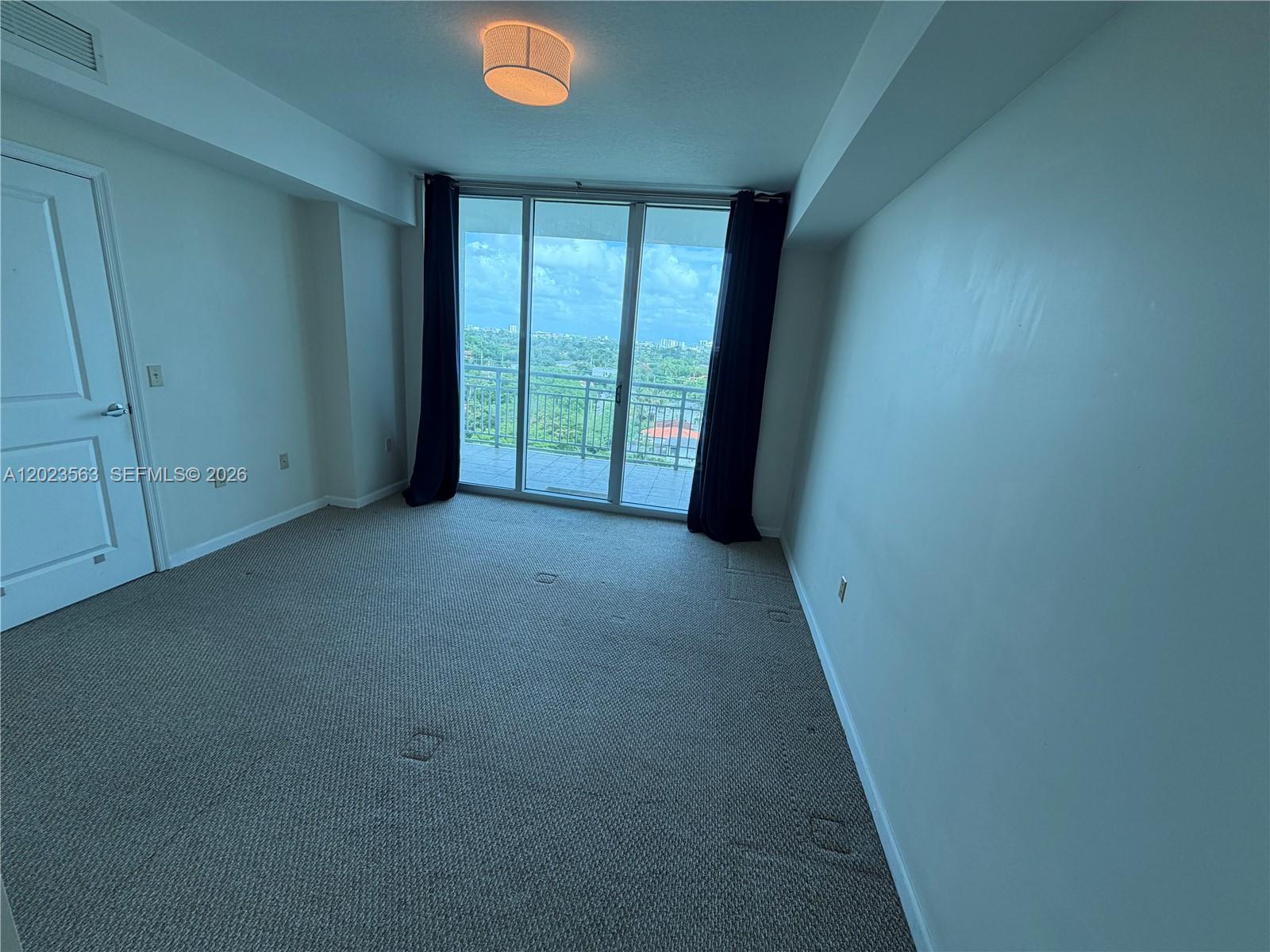 2021 Southwest 3rd Avenue, Unit 902 Miami, FL 33129 - Photo 9 of 14 an empty room with windows