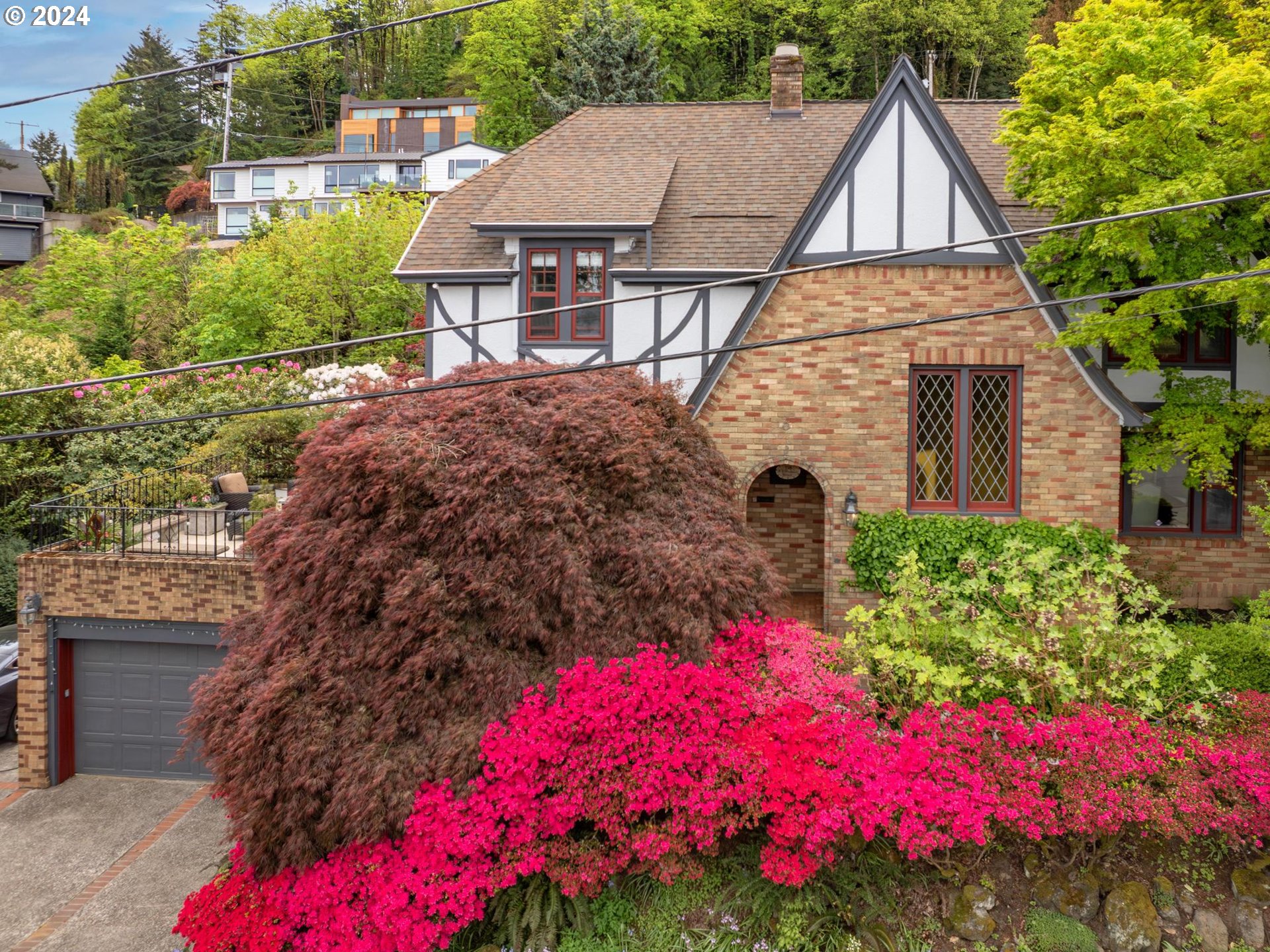 a view of a house with a yard and garden
