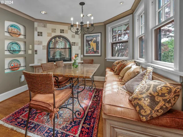 a view of a livingroom with furniture window and wooden floor