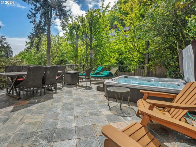 a view of a patio with table and chairs and potted plants