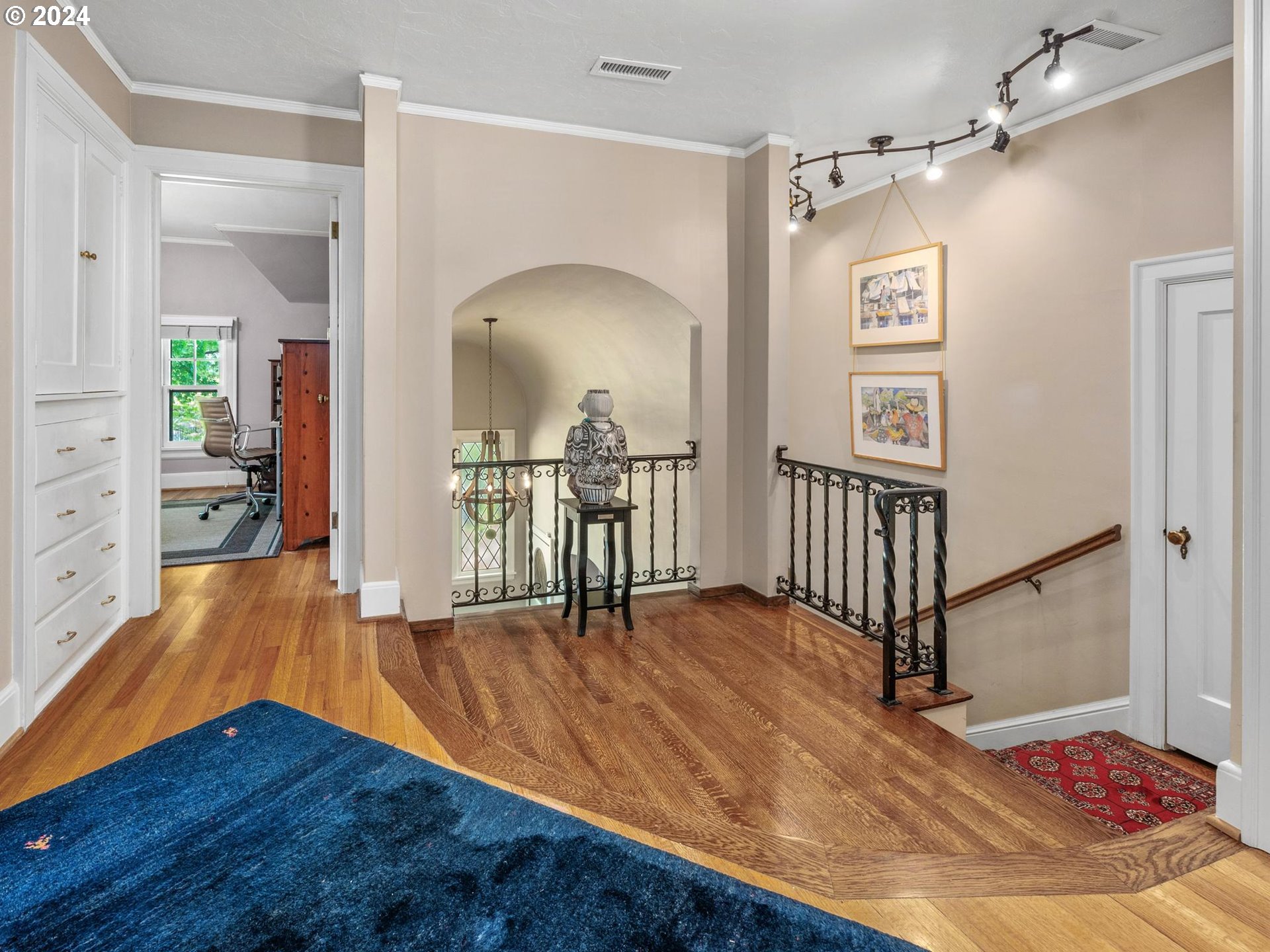 758 Northwest Powhatan Terrace Portland, OR 97210 - Photo 23 of 48 a view of a hallway with wooden floor and stairs