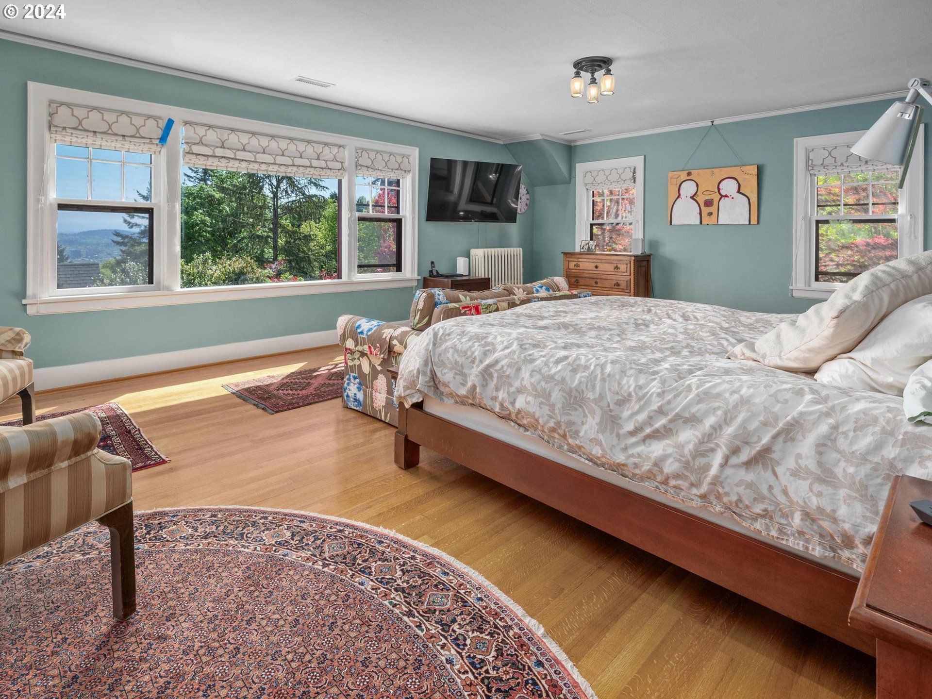 758 Northwest Powhatan Terrace Portland, OR 97210 - Photo 26 of 48 a bed sitting in a bedroom next to a window