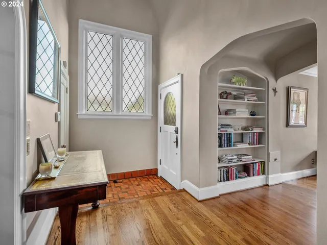 a view of a bedroom with furniture and window
