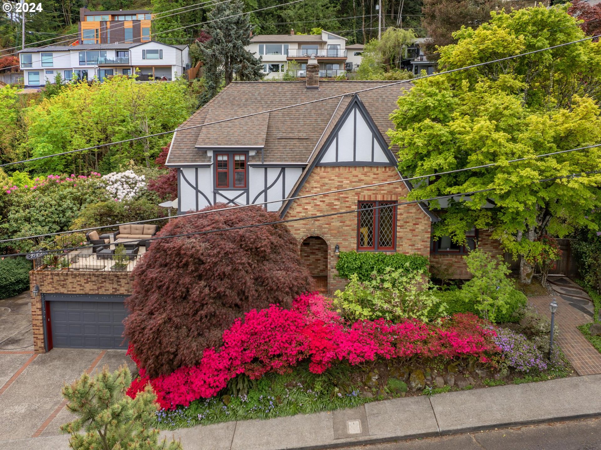 758 Northwest Powhatan Terrace Portland, OR 97210 - Photo 47 of 48 a view of a house with a yard and garden