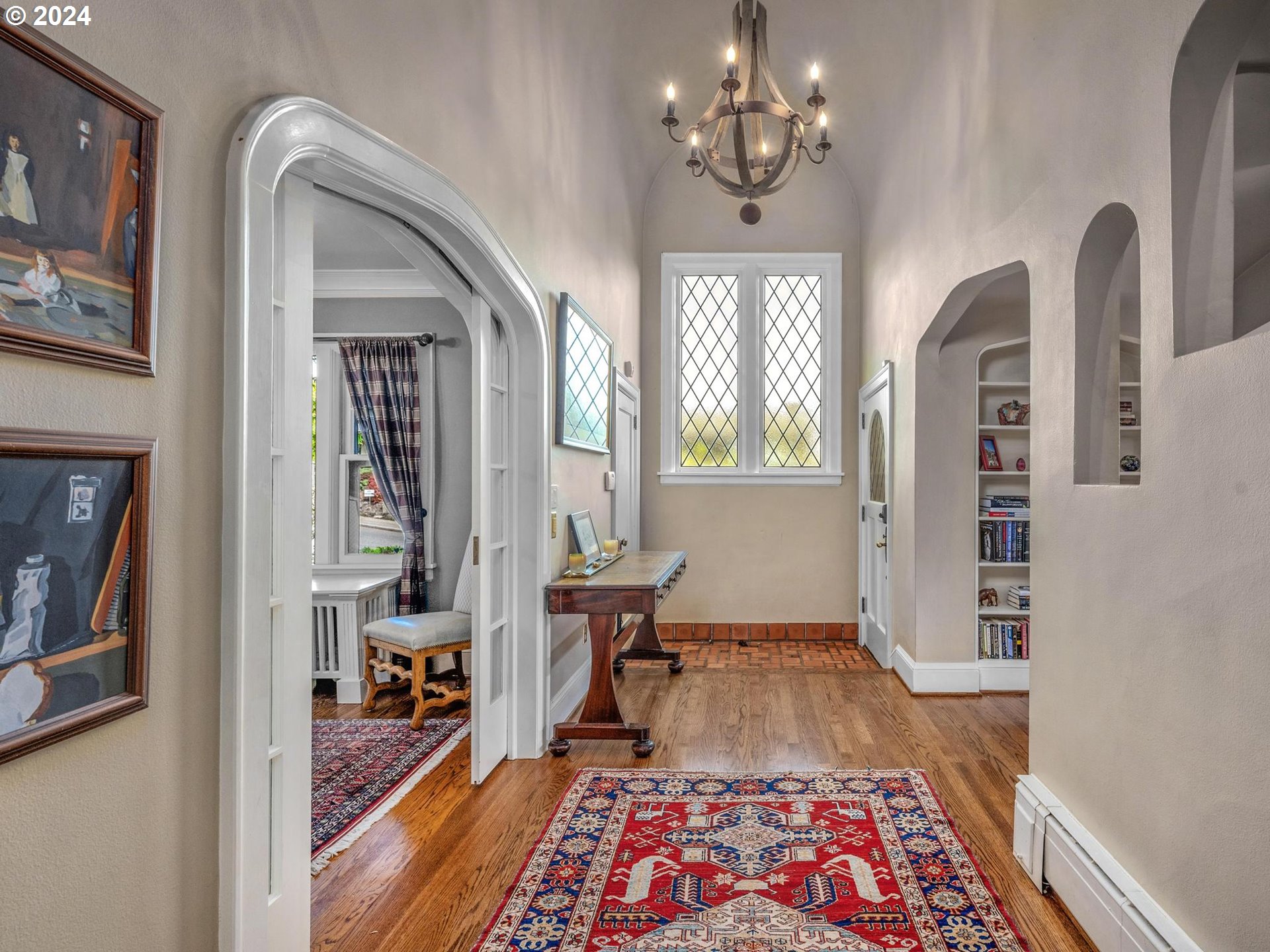 758 Northwest Powhatan Terrace Portland, OR 97210 - Photo 5 of 48 a living room with furniture and a chandelier
