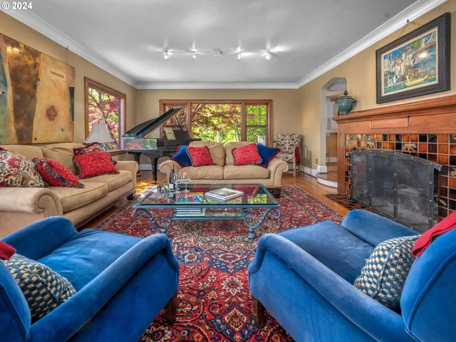 a living room with furniture and a rug