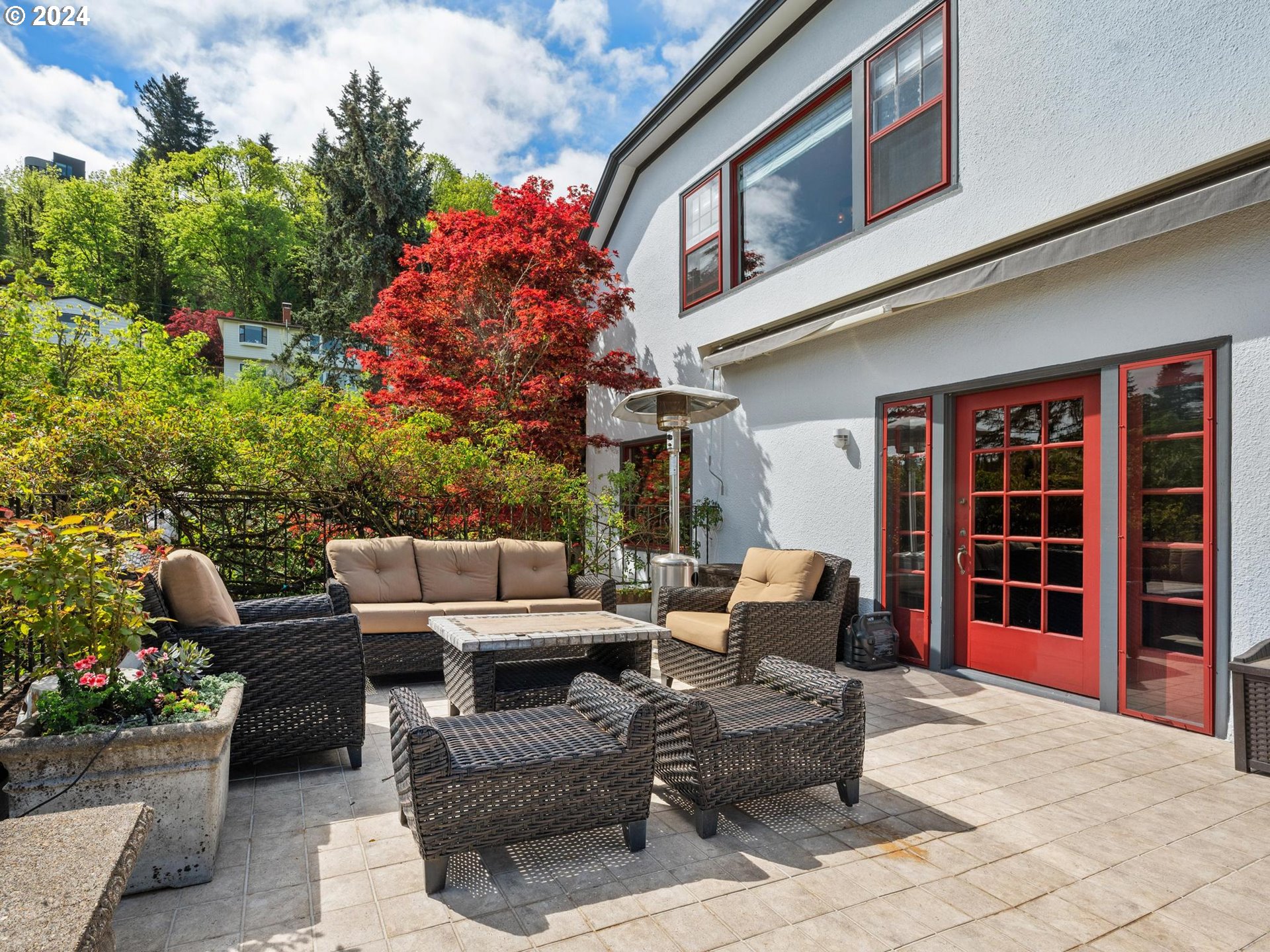 758 Northwest Powhatan Terrace Portland, OR 97210 - Photo 10 of 48 a view of a patio with couches table and chairs and potted plants