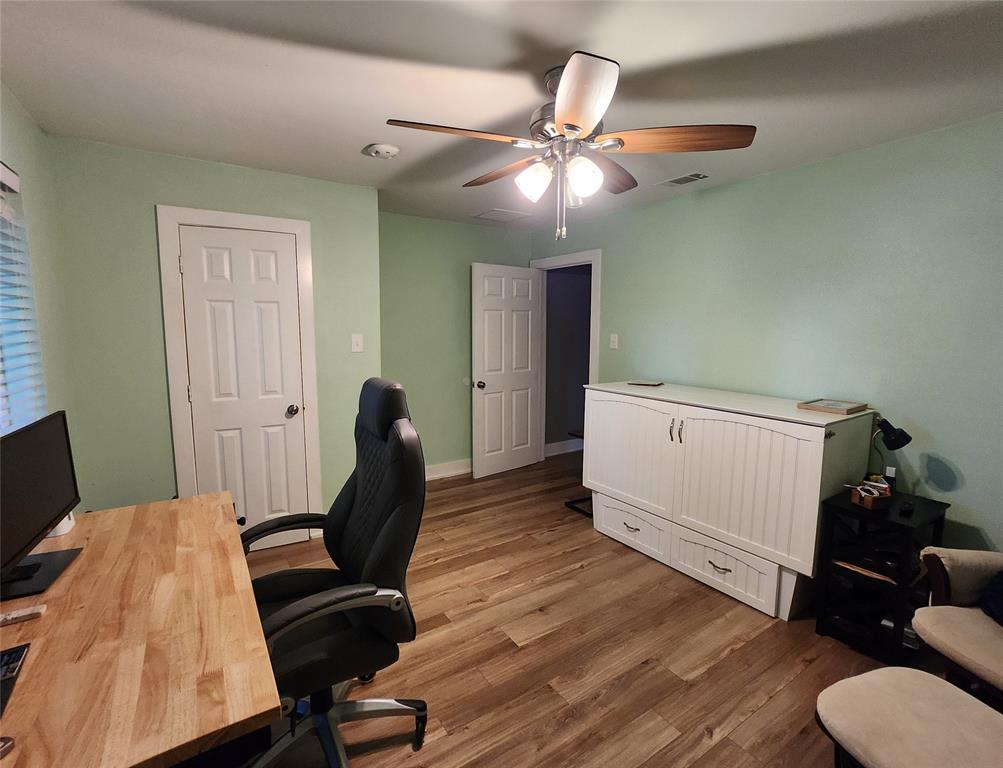 1023 Ridgefield Drive Plano, TX 75075 - Photo 22 of 39 a view of a workspace with furniture and wooden floor