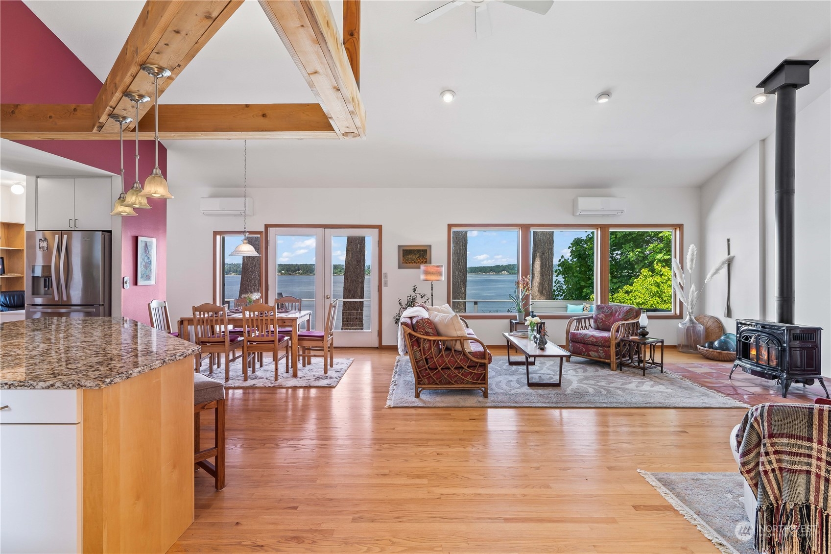 8615 Higgins Cove Road Anderson Island, WA 98303 - Photo 11 of 40 a living room with fireplace furniture and a large window