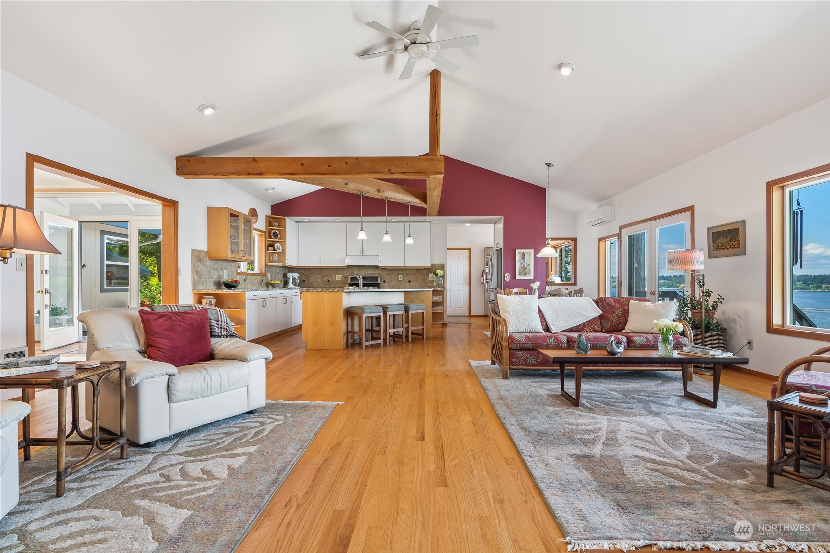 8615 Higgins Cove Road Anderson Island, WA 98303 - Photo 13 of 40 a living room with furniture fireplace and a table
