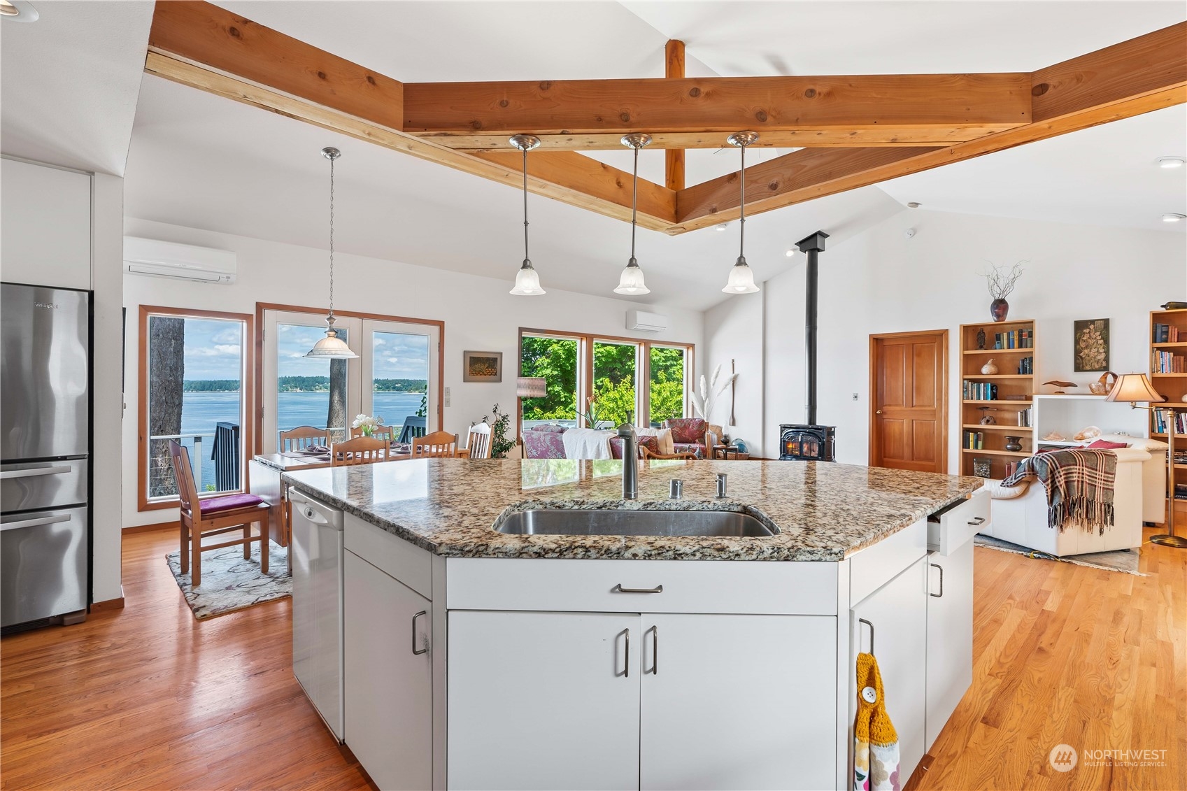 8615 Higgins Cove Road Anderson Island, WA 98303 - Photo 15 of 40 a kitchen with stainless steel appliances granite countertop a sink and a refrigerator