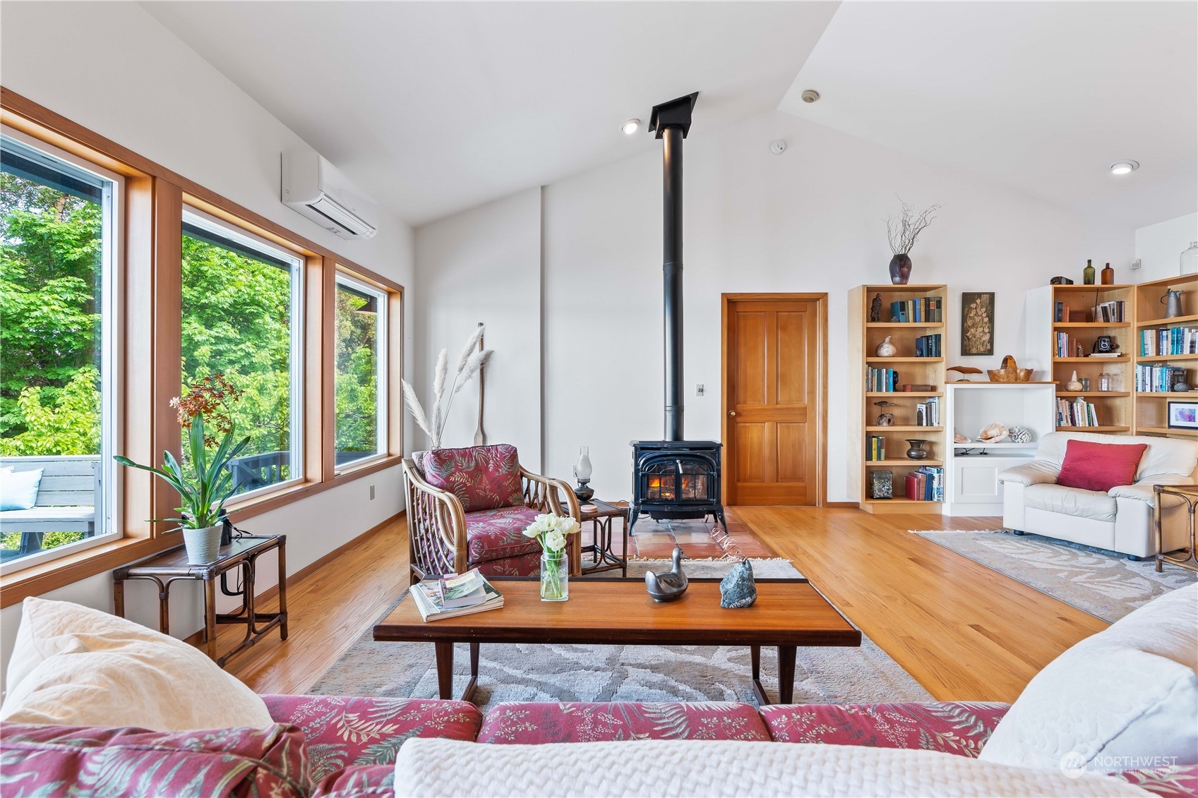 8615 Higgins Cove Road Anderson Island, WA 98303 - Photo 18 of 40 a living room with furniture a rug and a large window