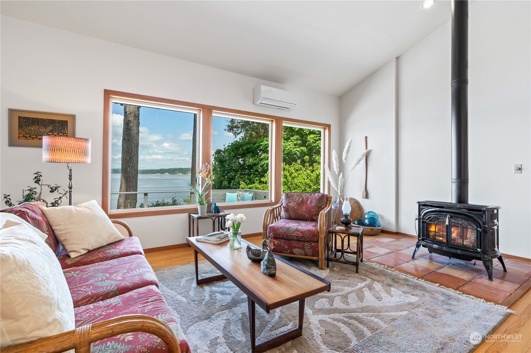 8615 Higgins Cove Road Anderson Island, WA 98303 - Photo 19 of 40 a living room with furniture and a large window