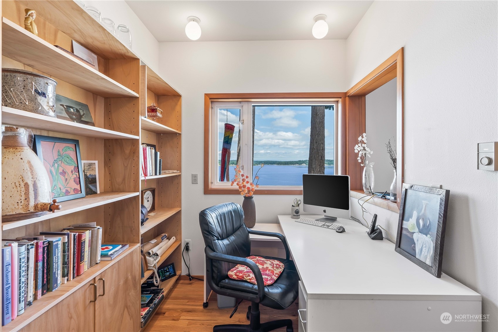 8615 Higgins Cove Road Anderson Island, WA 98303 - Photo 20 of 40 a room with furniture cabinets and book shelf