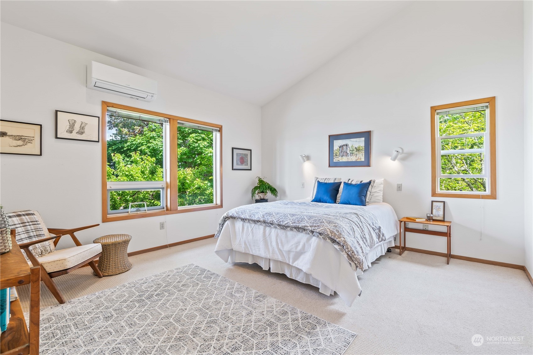 8615 Higgins Cove Road Anderson Island, WA 98303 - Photo 21 of 40 a spacious bedroom with a bed and a couch