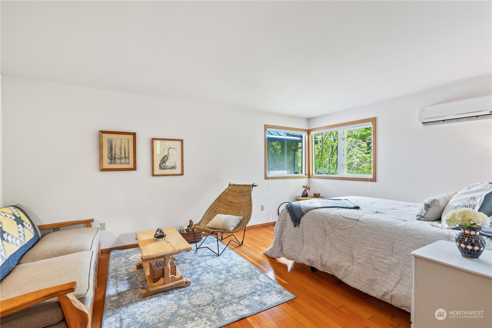 8615 Higgins Cove Road Anderson Island, WA 98303 - Photo 25 of 40 a bed room with a bed and wooden floor