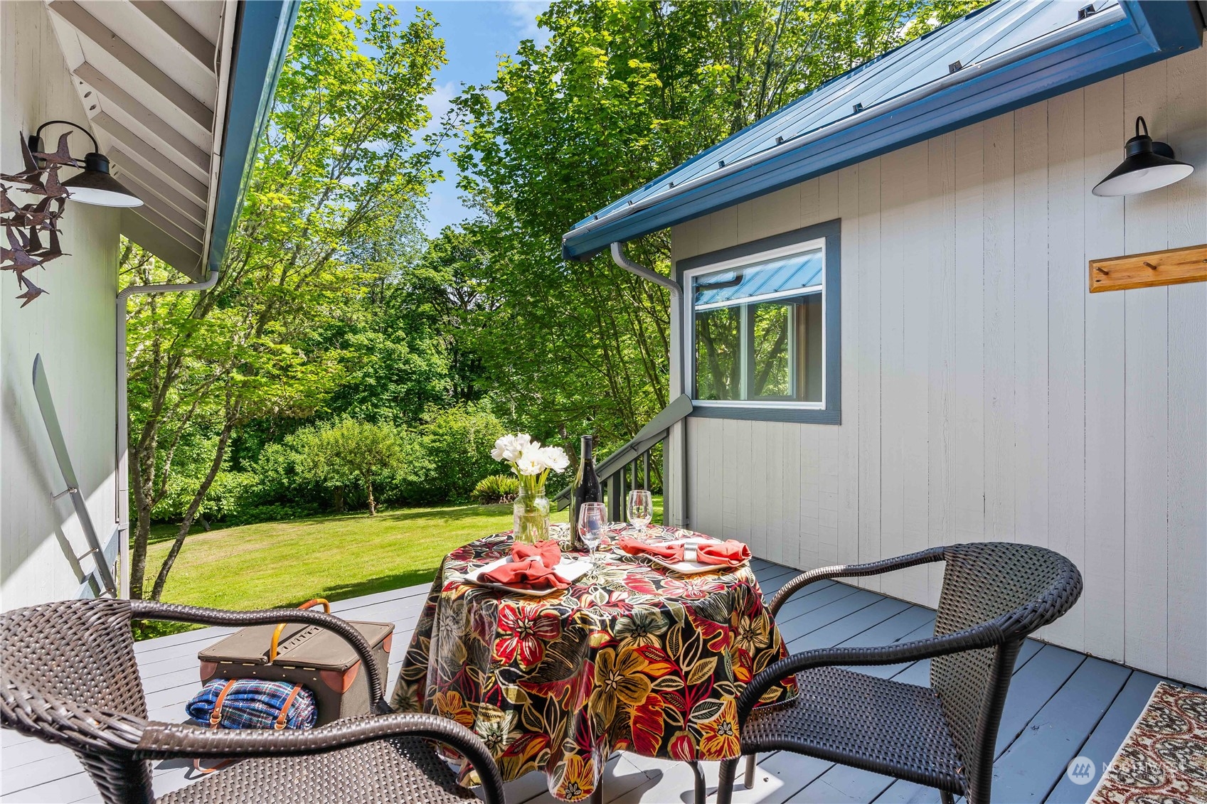 8615 Higgins Cove Road Anderson Island, WA 98303 - Photo 33 of 40 a view of a chairs and table in backyard