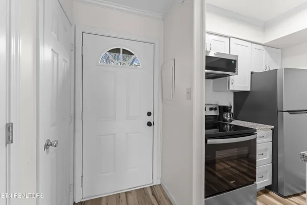 a bathroom with a sink mirror and toilet