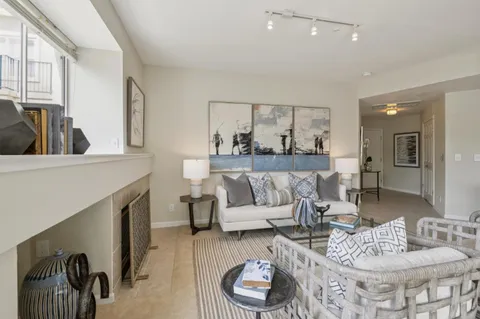 a living room with furniture and a painting
