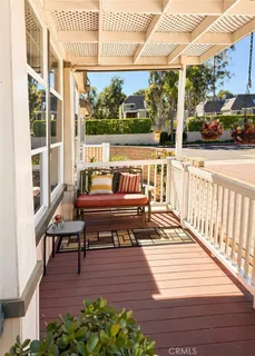 a view of a wooden deck with outdoor seating