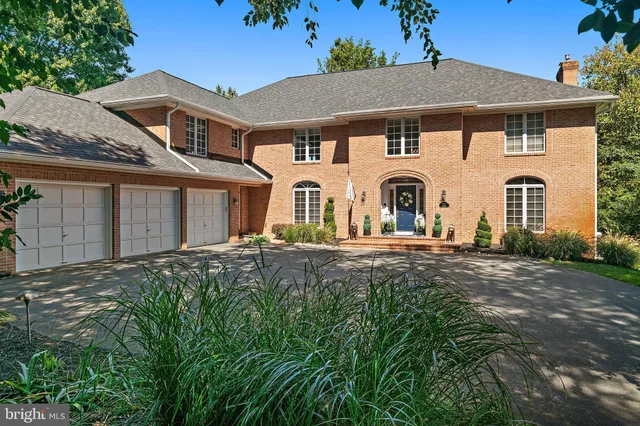a front view of a house with yard