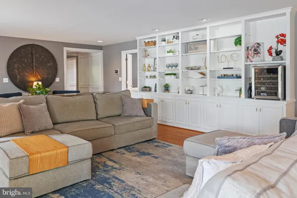 a kitchen with kitchen island a stove a table and chairs in it