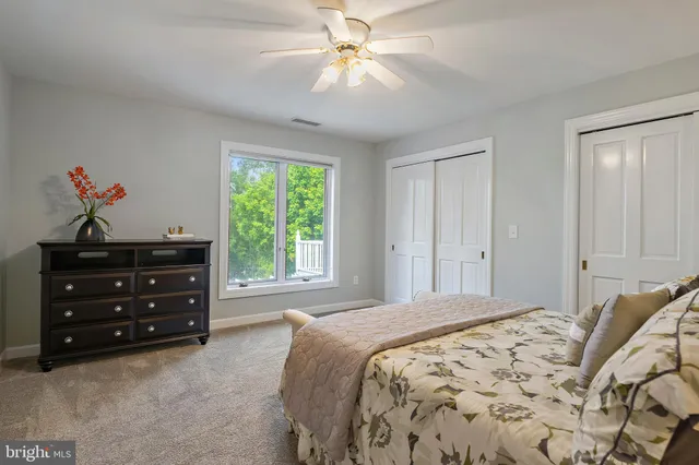 a reading room with furniture and a window