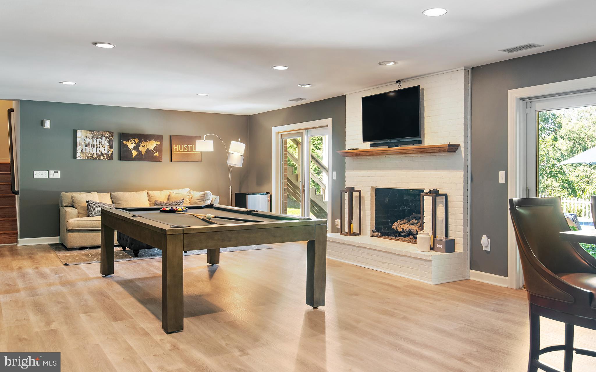 812 Coachway Annapolis, MD 21401 - Photo 48 of 75 a living room with furniture a fireplace and a flat screen tv