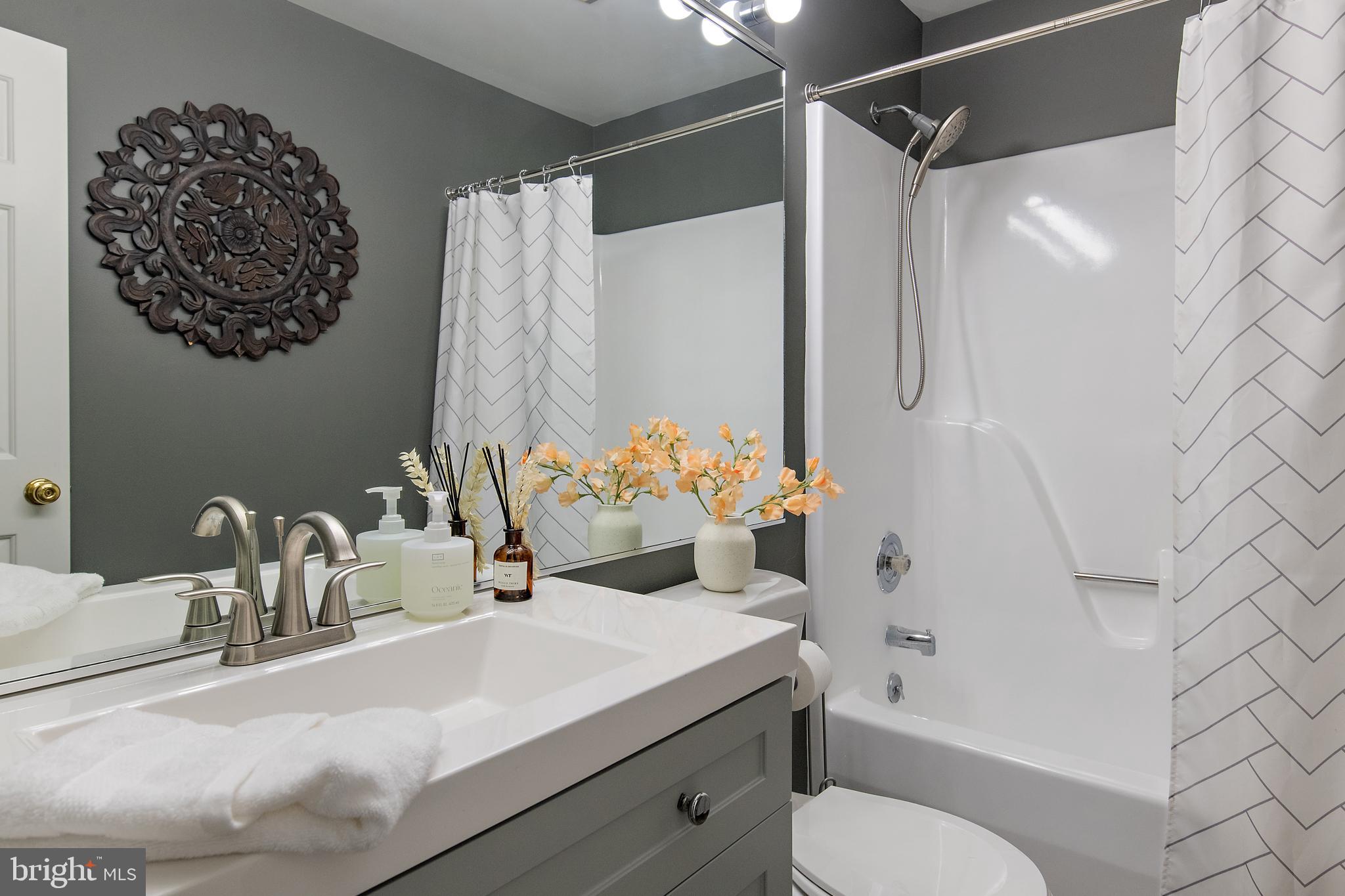 812 Coachway Annapolis, MD 21401 - Photo 51 of 75 a bathroom with a sink toilet and shower