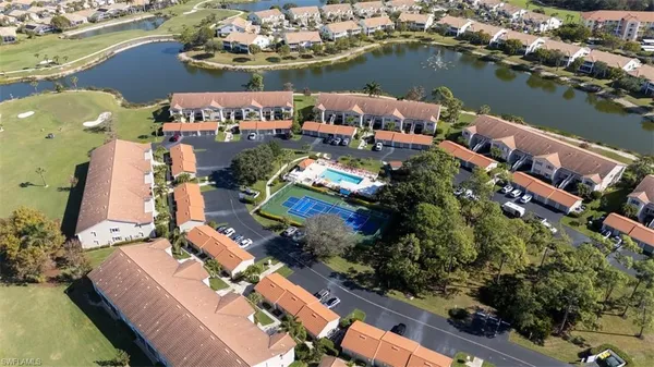 an aerial view of a house with a lake view
