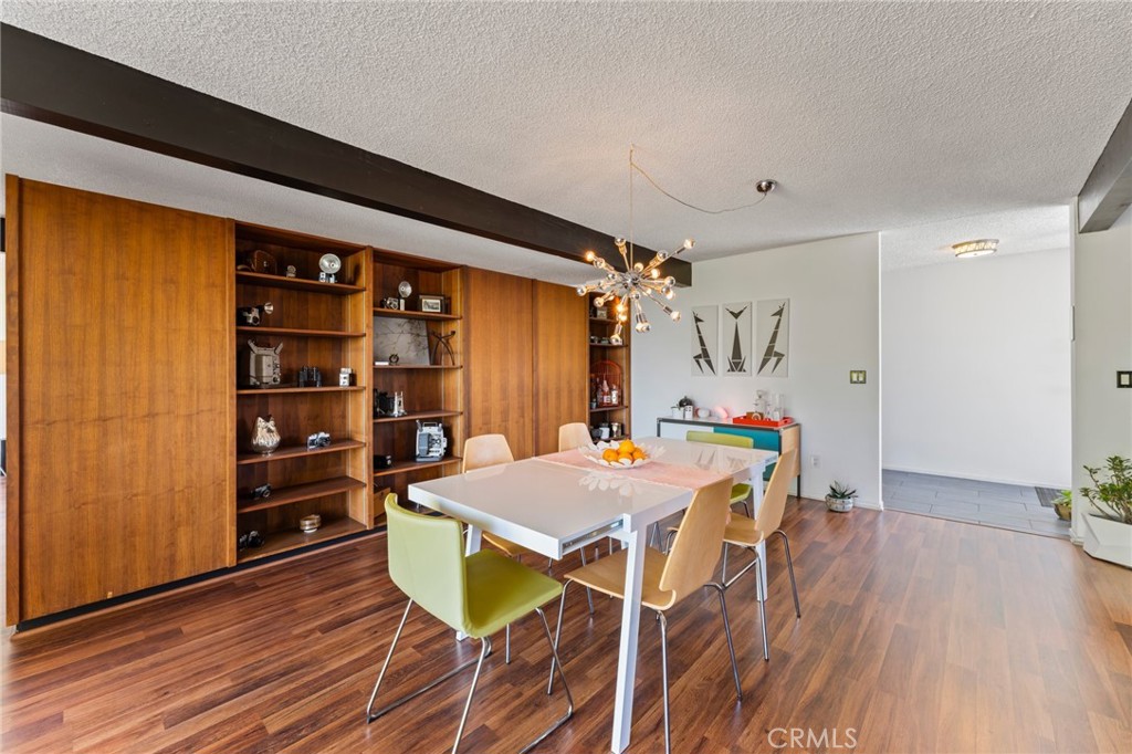 4259 Quail Road Riverside, CA 92507 - Photo 15 of 72 a view of a dining room with furniture and wooden floor