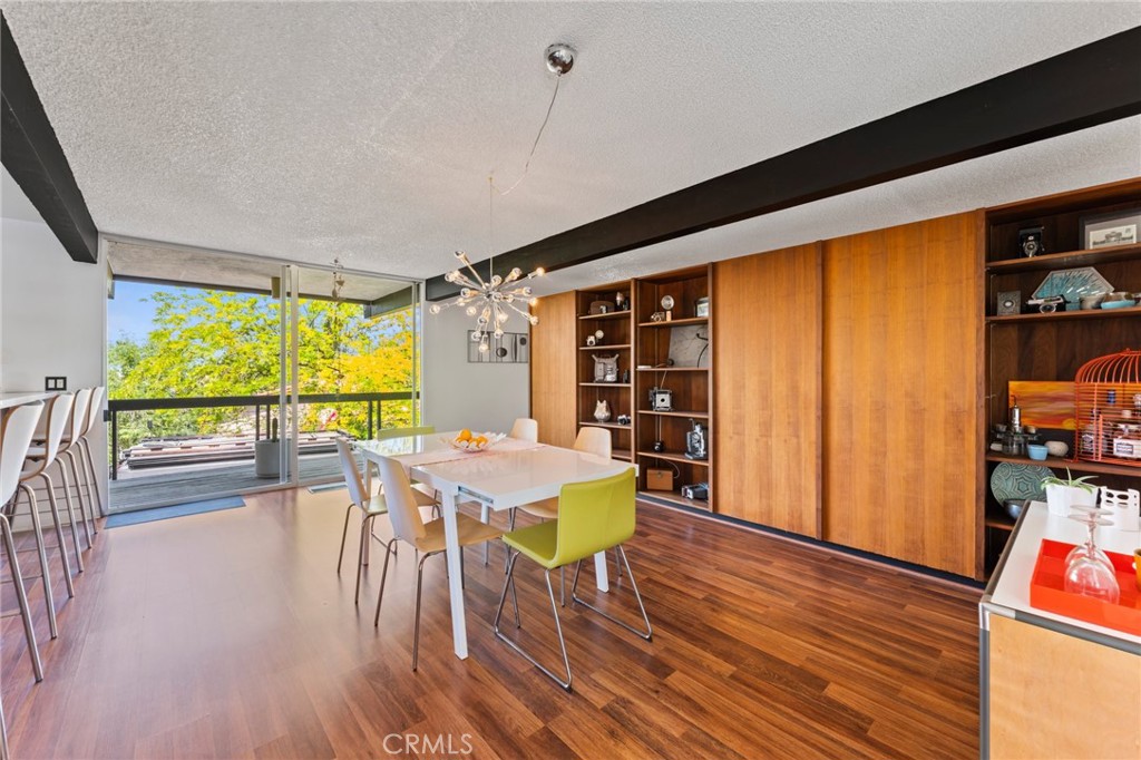 4259 Quail Road Riverside, CA 92507 - Photo 17 of 72 a dining room with furniture and wooden floor