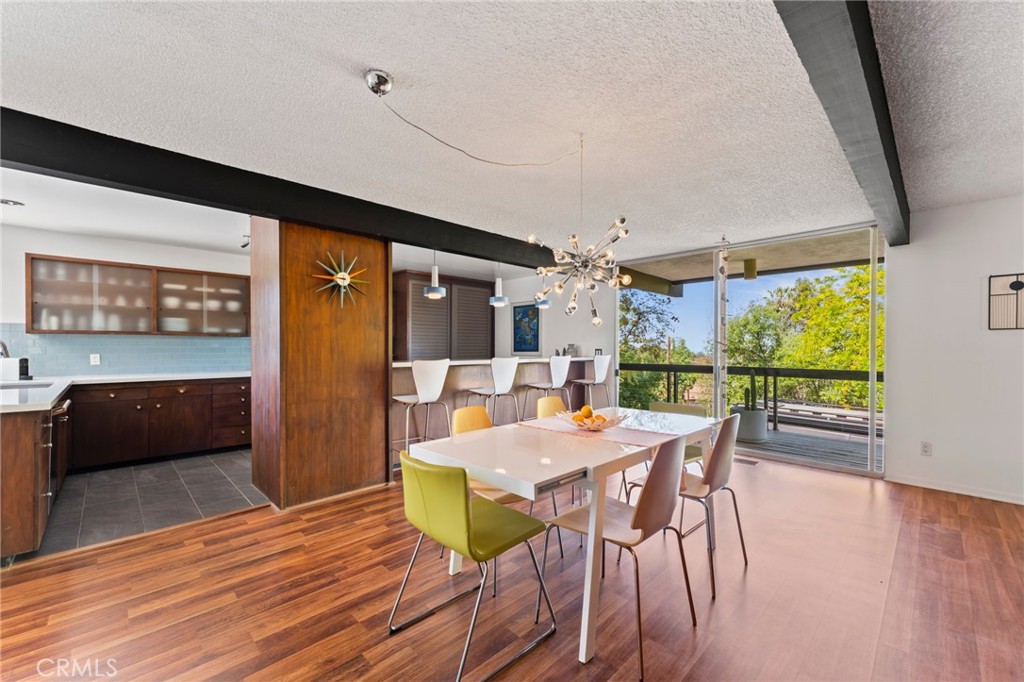 4259 Quail Road Riverside, CA 92507 - Photo 18 of 72 a view of a dining room with furniture and wooden floor