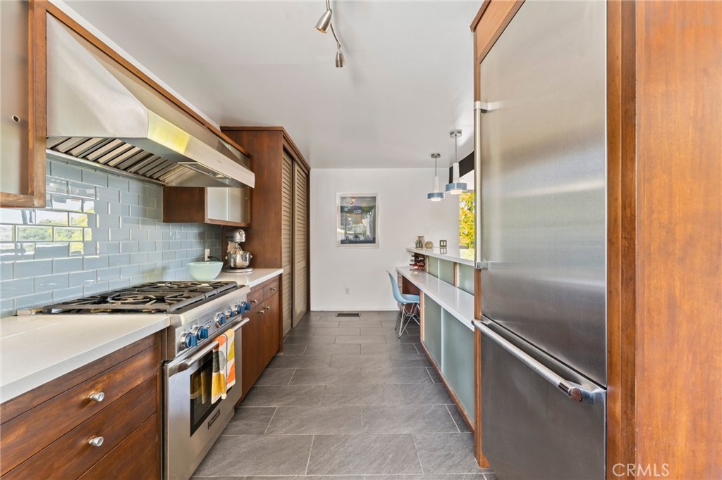 4259 Quail Road Riverside, CA 92507 - Photo 20 of 72 a kitchen with stainless steel appliances granite countertop a stove and a refrigerator