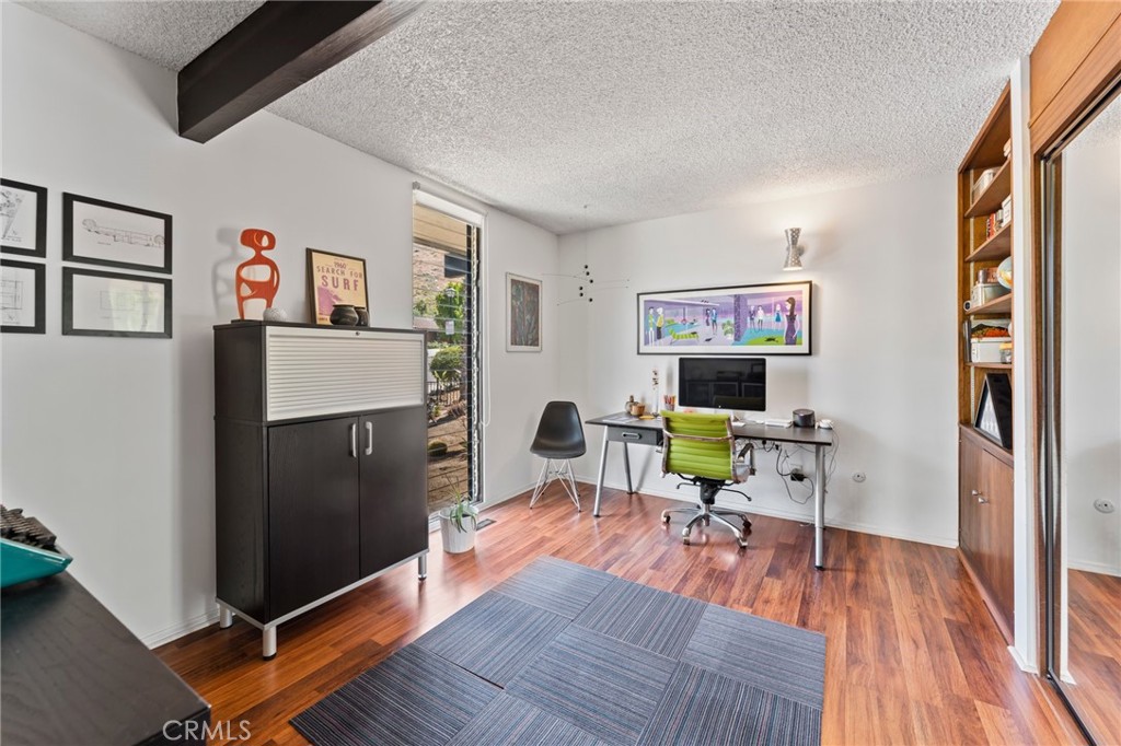4259 Quail Road Riverside, CA 92507 - Photo 24 of 72 a living room with furniture and a wooden floor