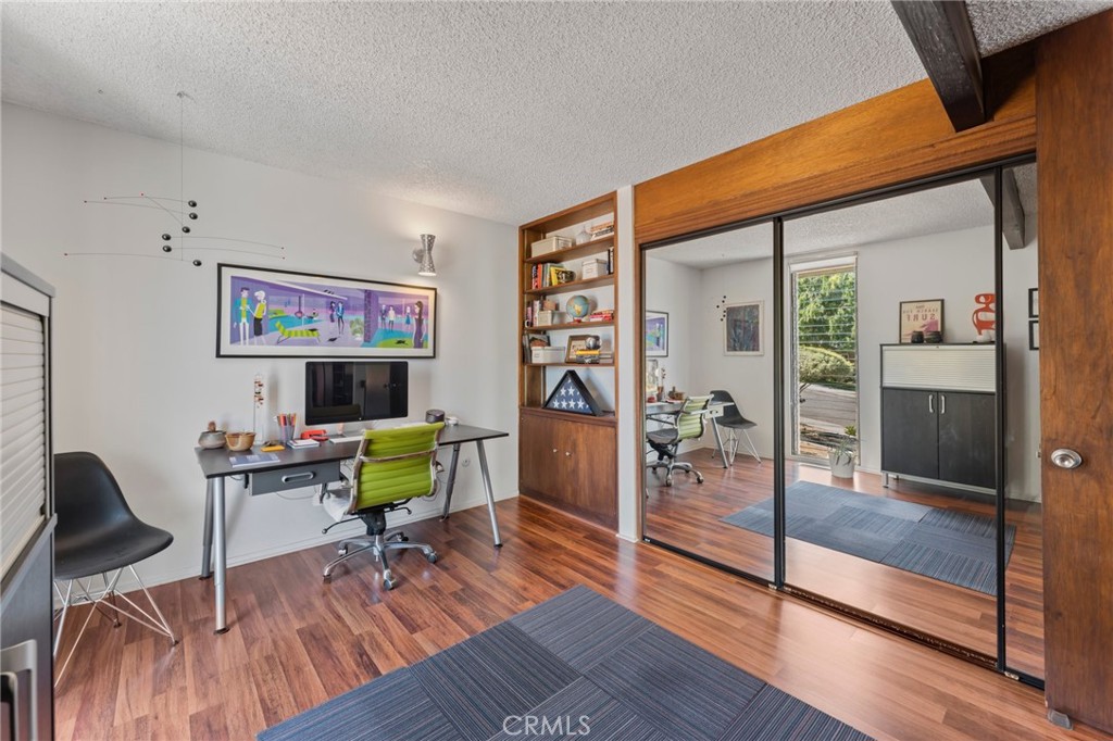 4259 Quail Road Riverside, CA 92507 - Photo 25 of 72 a living room with furniture and a wooden floor