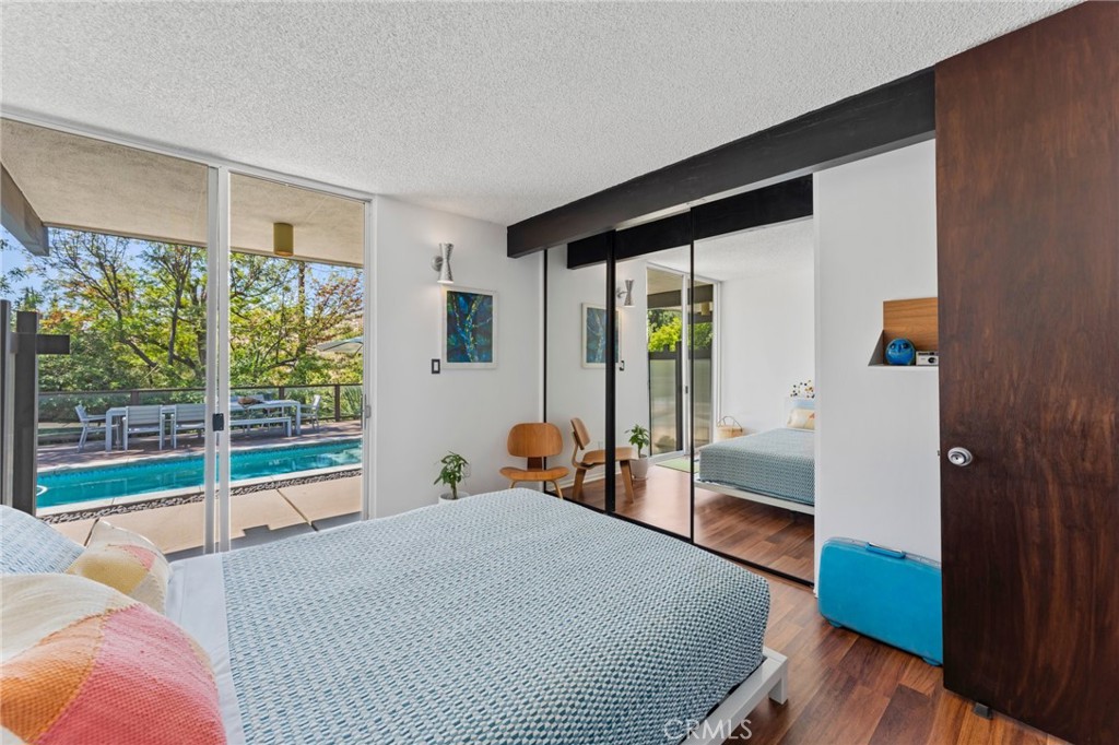 4259 Quail Road Riverside, CA 92507 - Photo 27 of 72 a bedroom with a bed and a large window