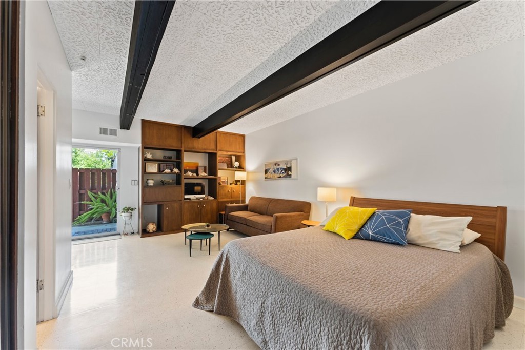 4259 Quail Road Riverside, CA 92507 - Photo 38 of 72 a bedroom with a bed and wooden floor