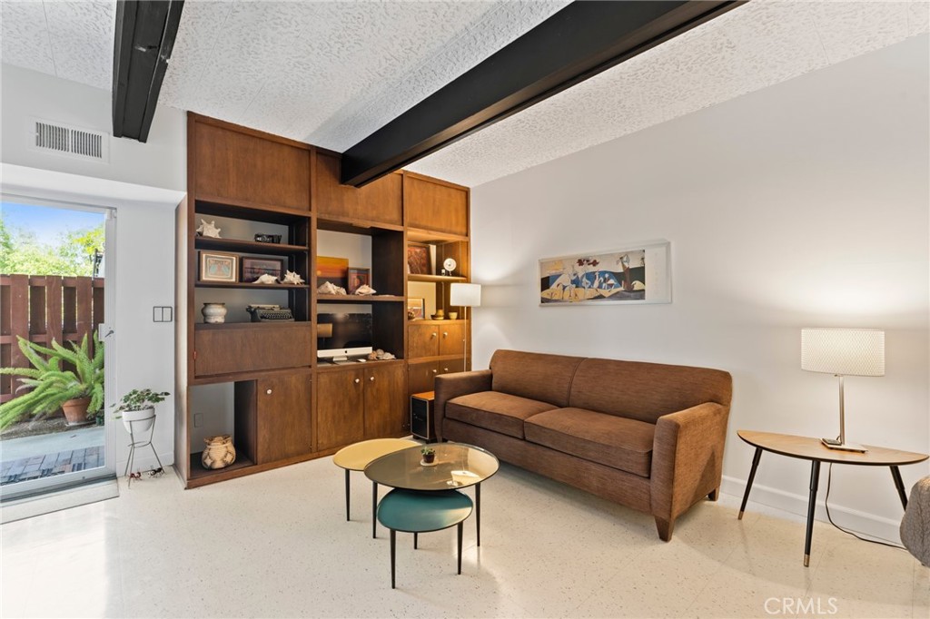4259 Quail Road Riverside, CA 92507 - Photo 39 of 72 a living room with furniture and a potted plant