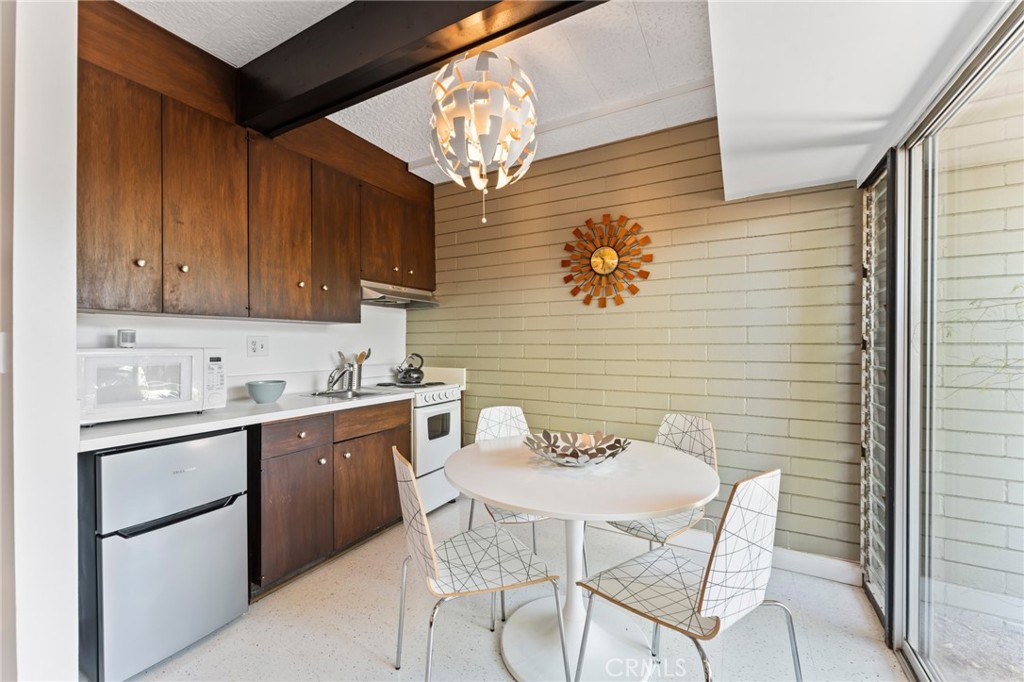 4259 Quail Road Riverside, CA 92507 - Photo 44 of 72 a kitchen with stainless steel appliances granite countertop a sink and cabinets