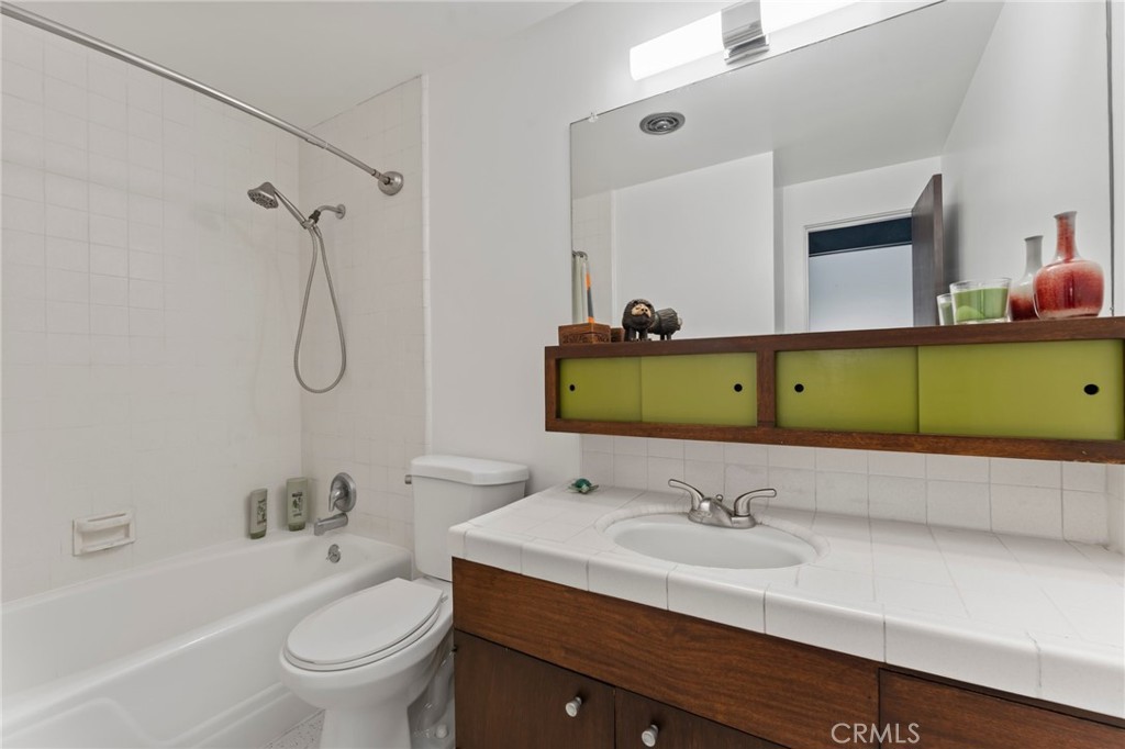 4259 Quail Road Riverside, CA 92507 - Photo 45 of 72 a bathroom with a sink and a mirror