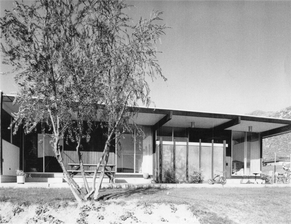 4259 Quail Road Riverside, CA 92507 - Photo 61 of 72 a wooden bench sitting in front of a building