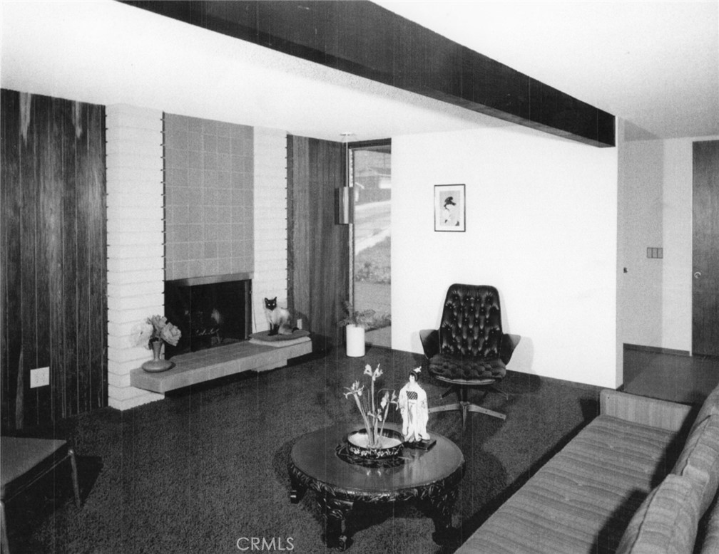 4259 Quail Road Riverside, CA 92507 - Photo 63 of 72 a living room with furniture and a fireplace