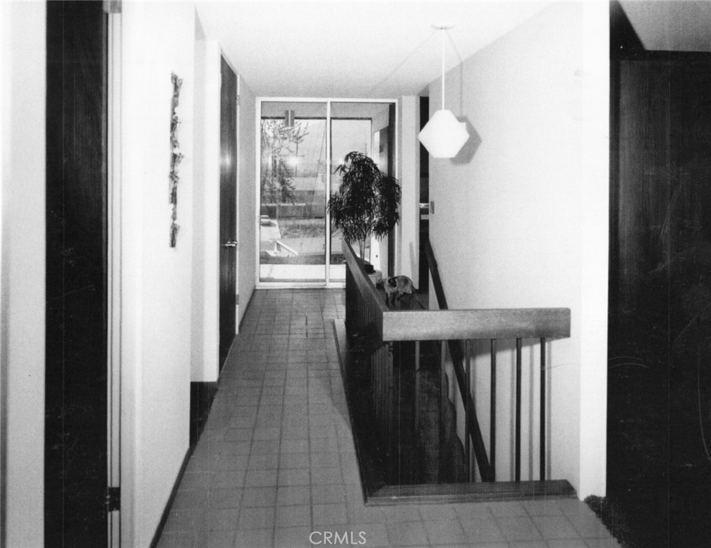 4259 Quail Road Riverside, CA 92507 - Photo 64 of 72 a view of a hallway with wooden floor and stairs