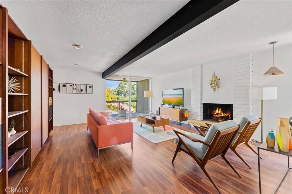 4259 Quail Road Riverside, CA 92507 - Photo 9 of 72 a living room with furniture and a fireplace