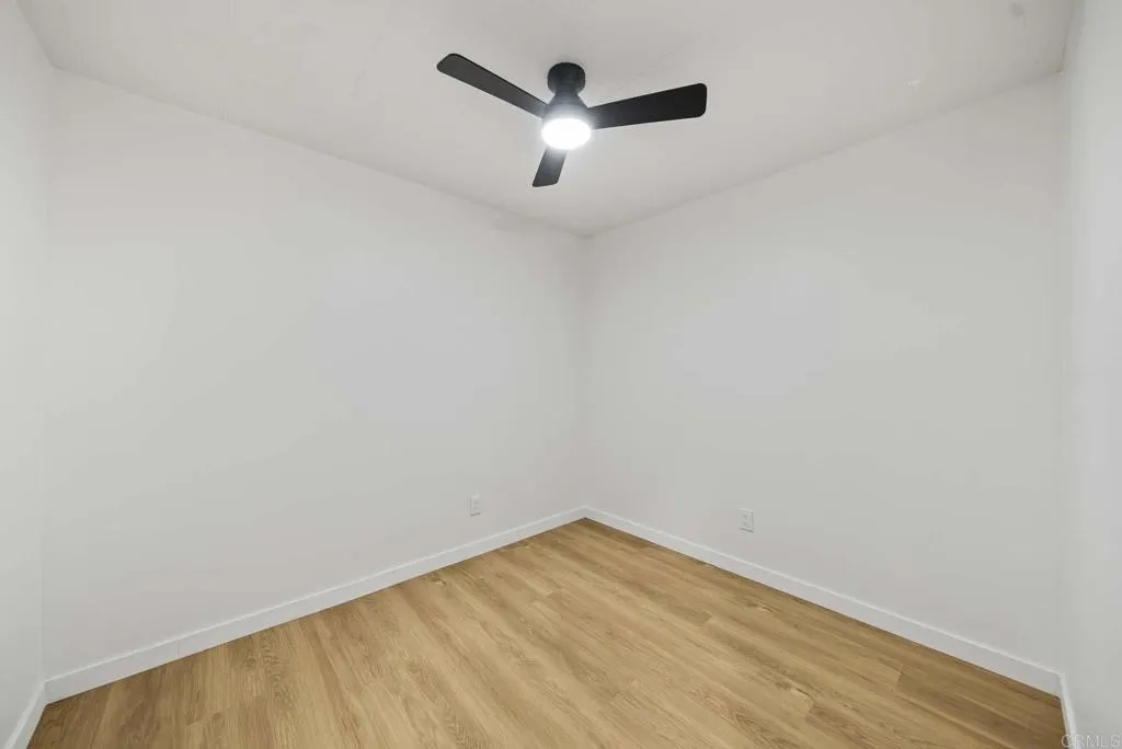 8301 Mission Gorge Road, Unit 253 Santee, CA 92071 - Photo 13 of 40 a view of empty room with wooden floor