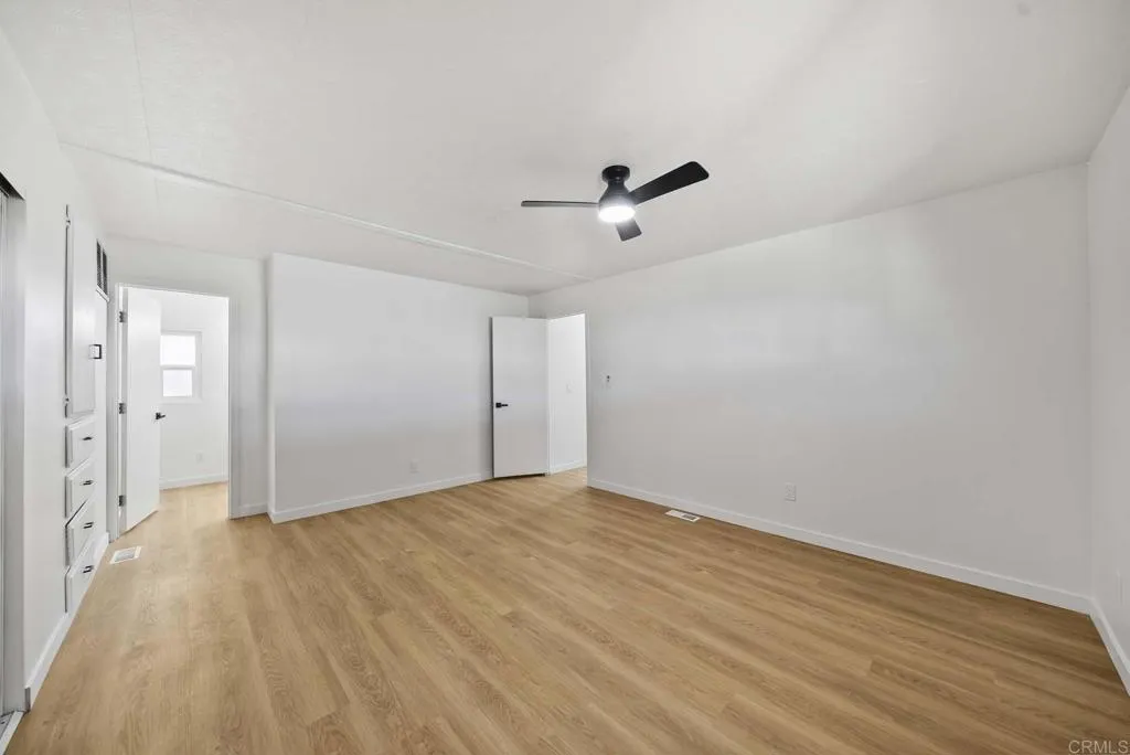 8301 Mission Gorge Road, Unit 253 Santee, CA 92071 - Photo 16 of 40 a view of empty room with wooden floor