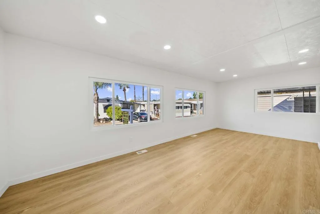 8301 Mission Gorge Road, Unit 253 Santee, CA 92071 - Photo 21 of 40 a view of livingroom with hardwood floor and a ceiling fan