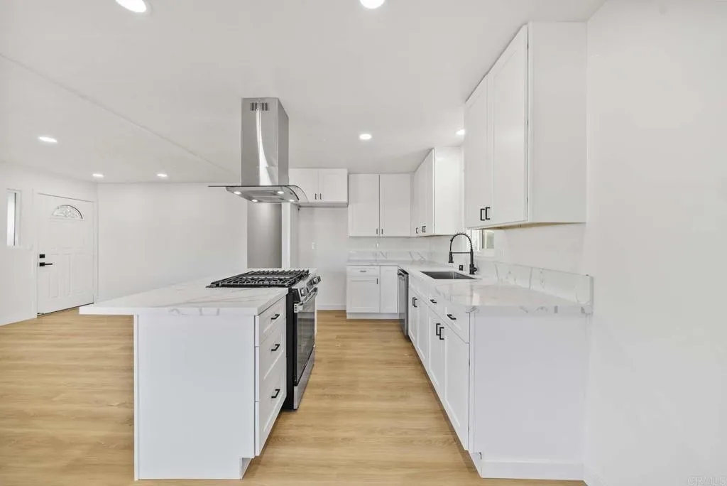 8301 Mission Gorge Road, Unit 253 Santee, CA 92071 - Photo 23 of 40 a kitchen with stainless steel appliances granite countertop a sink stove and refrigerator